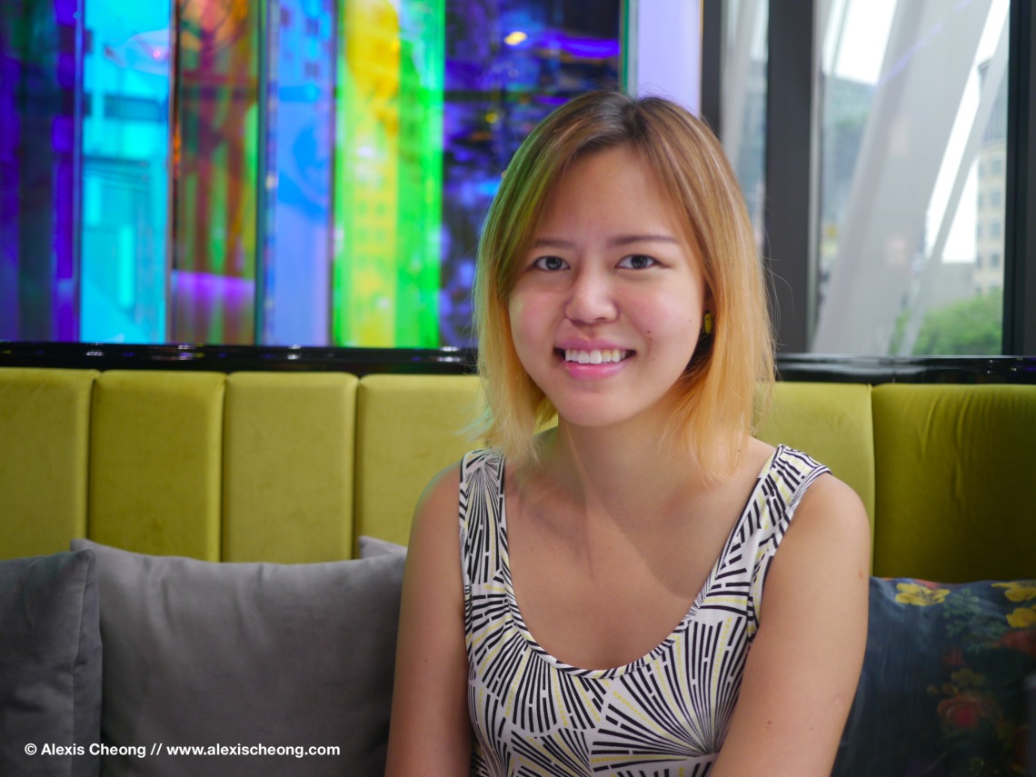 Singapore food blogger Alexis Cheong seated in a café